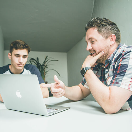 two guys at a computer planning a job